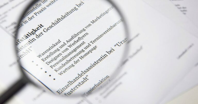 Close-up of a computer screen displaying resume text being scanned