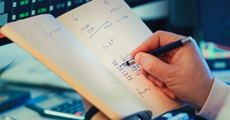 a person taking notes about a task