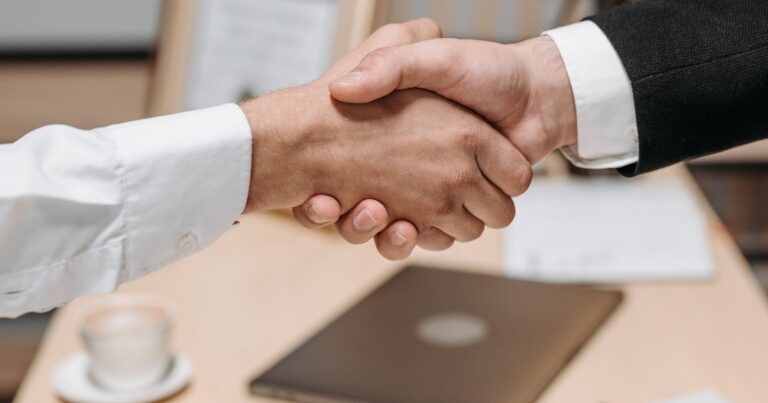 two people shaking hands
